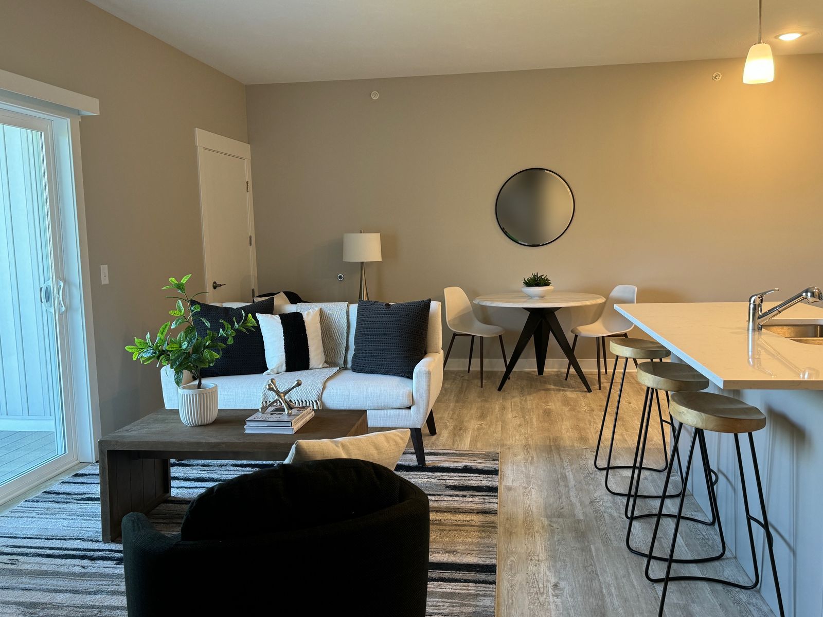 Living room with sliding door to the patio and dining area